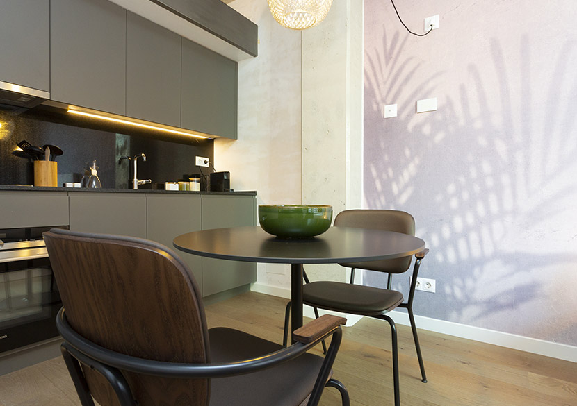 belvillage-diputacio-kitchen-dining-area-elegant-dark-cabinets.jpg