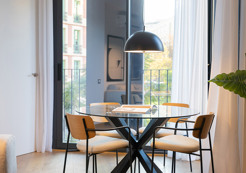 belvillage-napols-barcelona-dining-area-bright-balcony-access.jpg
